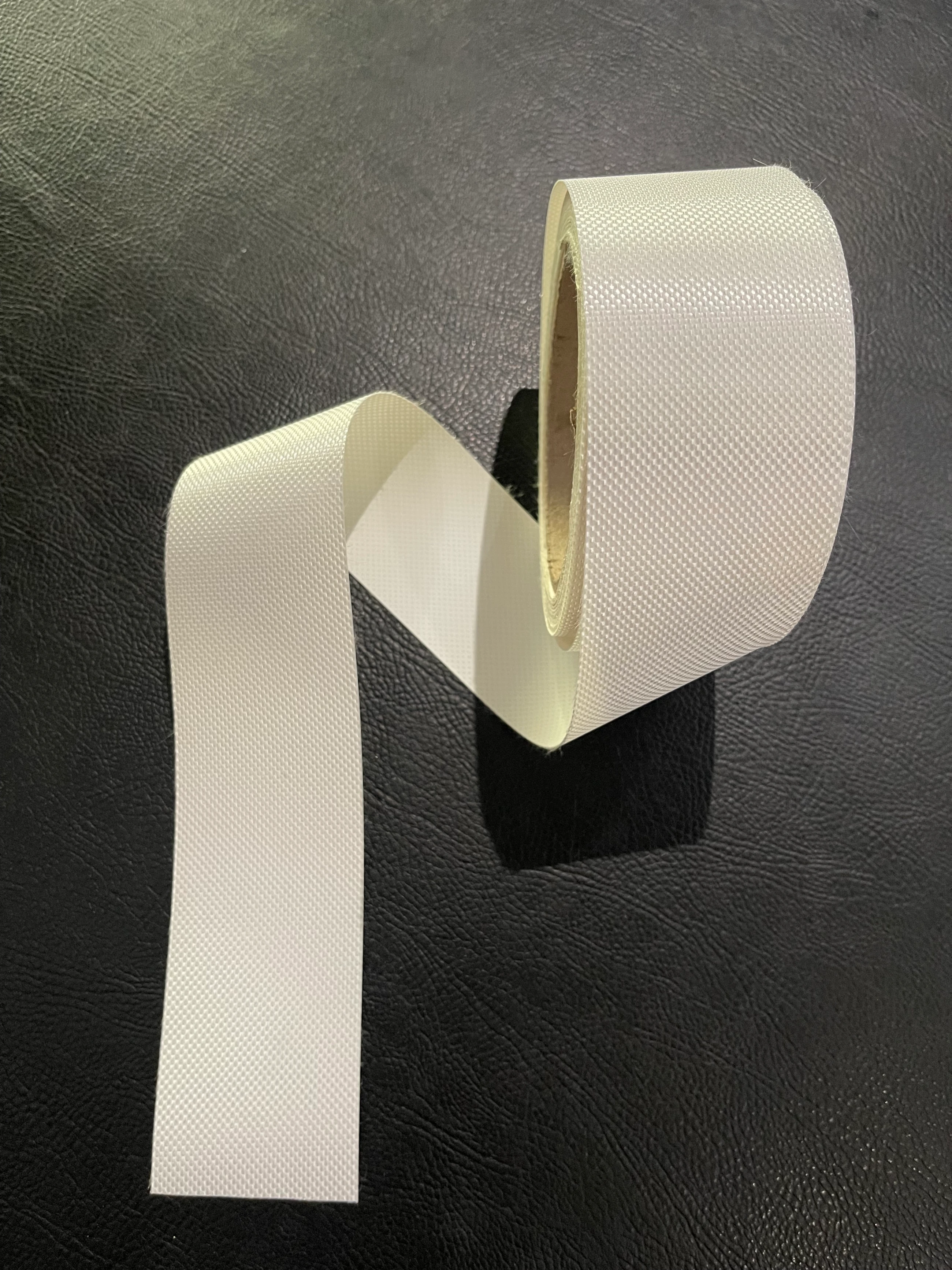 Close-up of 50mm weld-tape used to hem a banner